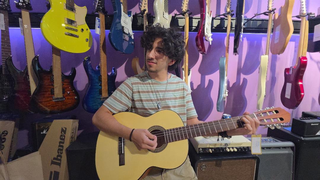 Mustafa with his acoustic guitar